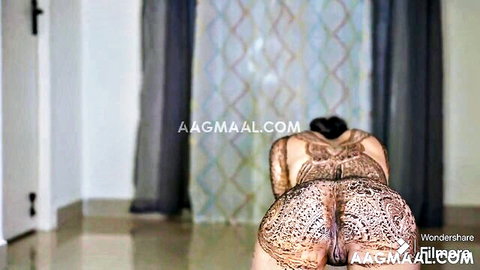 Henna-tattooed South Asian babe bends over exposing big juicy ass cheeks