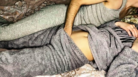 Young step sister in grey pajamas exposes midriff for intimate touch on bed