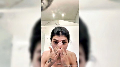 Mia Khalifa naked with big tits covering eyes seductively