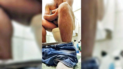 Hairy man pants down on toilet for morning pooping fart