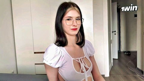 Cute Asian classmate in glasses and low-cut top studying