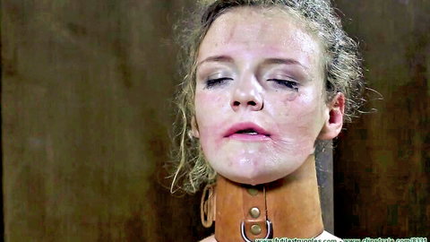 Diamondly in leather collar, distressed BDSM bondage scene