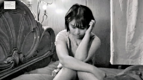 Thin Indian woman Summer sits pensively on bed in Summer Secrets 3