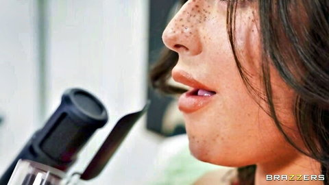 Jacqueline Valentine close-up whispering into mic in ASMR anal play