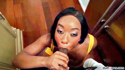 Ebony babe in yellow lingerie sucking thick black cock with hand gripping shaft