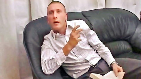 Shaved-head man in checkered shirt gesturing intensely, unleashing inner demons