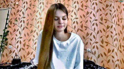 Lizbethconnett modest Chaturbate webcam tease, long-haired beauty in white top