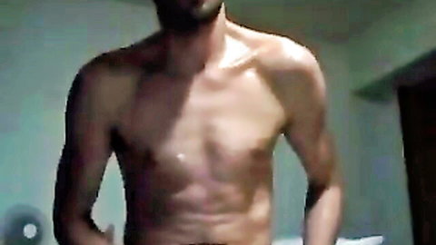 Muscular shirtless man showing toned abs in solo scene