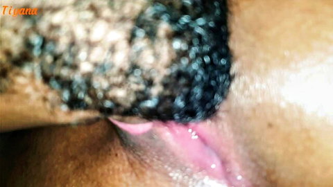 Close-up of dark-skinned hand rubbing light-skinned hotwife's wet pussy before creampie