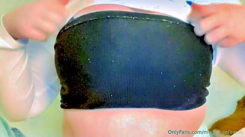 Sexy babe bends over in bathroom pulling tight shiny black thong between juicy ass cheeks