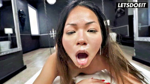Asian babe with wide open mouth drooling thick cum from messy facial closeup