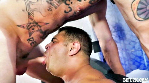 Tattooed muscular men in bisexual oral threesome action