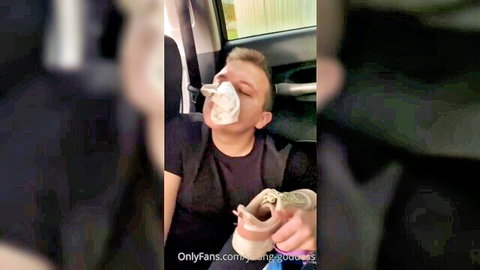 Young blonde man with cum on mouth holding cash in car, explicit OnlyFans preview