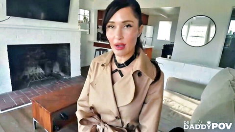 Sexy woman in trench coat and choker teases in POV kink scene