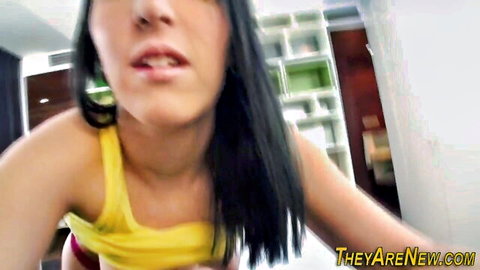 Close-up of young amateur teen with black hair in yellow tank top, open mouth expression