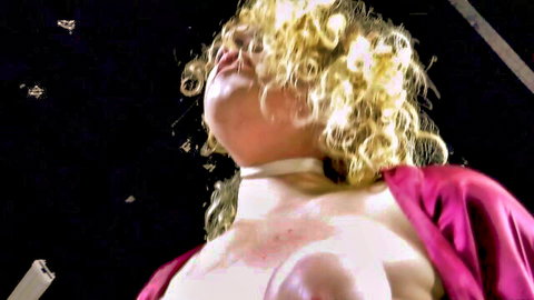 Blonde Diamondly hogtied, topless with exposed breasts and collar