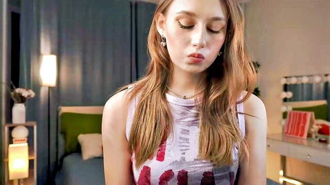 Sara Sansara shy young redhead camgirl teasing in tank top