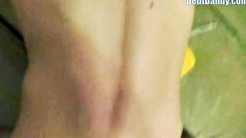 Pale woman exposes round ass in yellow panties pulled down from behind
