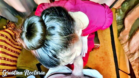 Grustina Nectaria kneeling in pink ruffled dress for POV oral