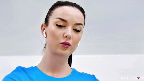 Mellany Lapiedra seductive close-up in blue tank top and earbuds