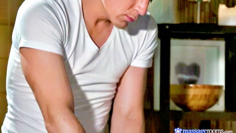 Muscular Caucasian man in white t-shirt during amateur sensual bodywork session