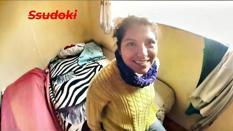 Smiling Latina woman in yellow sweater on bed, amateur creampie hookup