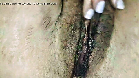 Close-up of hairy pussy and ass in solo dildo masturbation