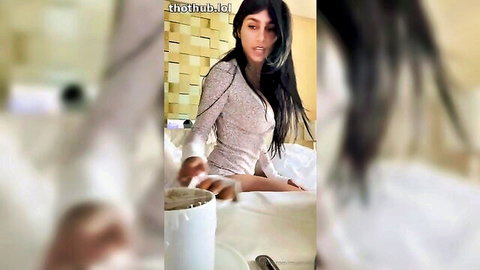 Mia Khalifa in sheer top enjoying breakfast in bed, seductive smile