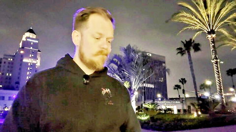 Bearded man in hoodie ponders at night cityscape with palms, Tales from 23&Me Pt. IV