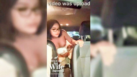 Busty Japanese hotwife with glasses sucks black cock in car backseat