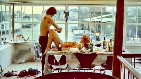 Mille Dinesen nude on dining table in intimate scene with partner, Nynne 2005