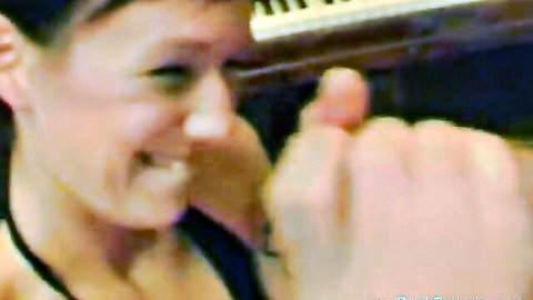 Naughty brunette with tongue out teases blowjob gesture with spread fingers near open mouth