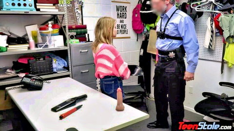 Petite blonde teen in tight jeans chats with cop beside huge pink dildo on desk
