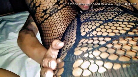 Black MILF in fishnet lingerie lets son's friend eat her pussy close-up