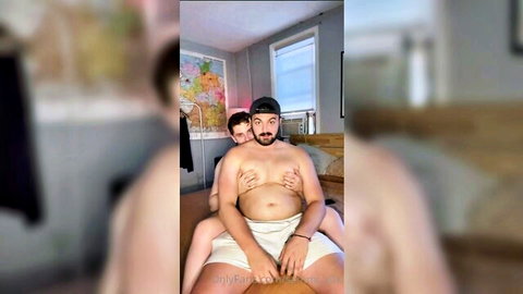 Shirtless chubby gay dude in white briefs gets chest groped by buddy from behind on bed