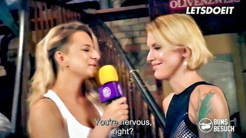 Blonde Jean Pallett looks nervous as Sina Longleg interviews her in revealing tops