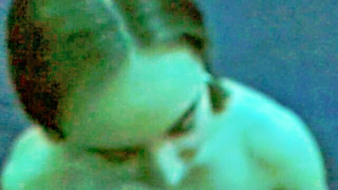 Close-up of young brunette with short hair, eyes closed, mouth open for blowjob visit
