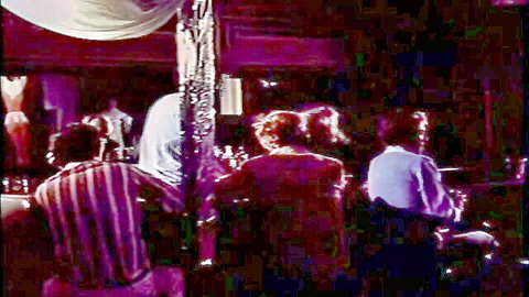 Vintage retro bar scene with clothed people standing under dim purple lights