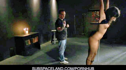 Skinny brunette babe bound suspended naked in ropes by dominant man in BDSM slave scene