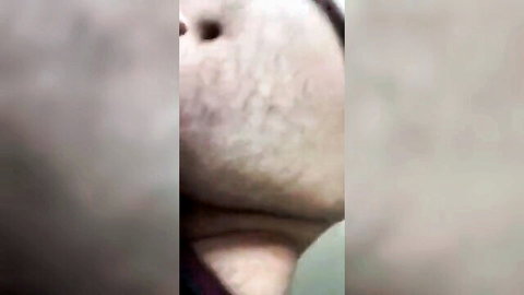 Blurry close-up of chubby pale man's face and neck in gay fetish thumbnail