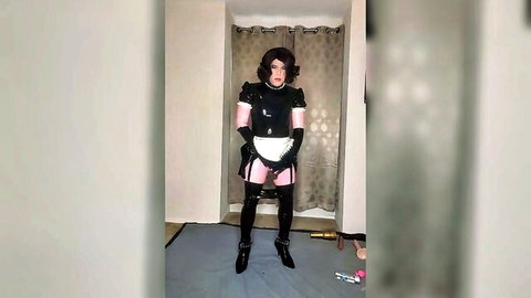 Sissy Candy Sparkle poses in shiny black and pink latex maid catsuit with gloves and heels