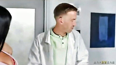 Brunette patient teases physical therapist in office exam
