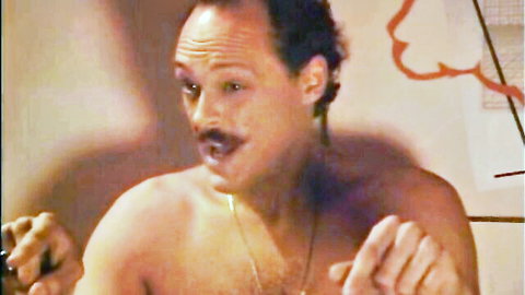 Shirtless retro man with mustache in 1983 adult film Alexandra