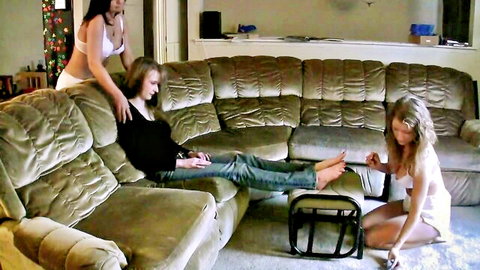 Natalia reclines as Amber and Nikki diaper her in intimate fetish scene