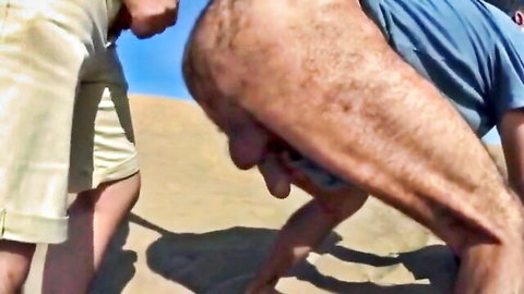 Hairy gay dude bent over on beach dune exposing bare ass balls and hard cock for outdoor stranger fuck
