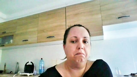 RoxannePhon mature blonde webcam model pouting in black top