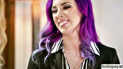 Teen Kenna with purple hair smiles at blonde MILF Jelena in striped blouse and blazer