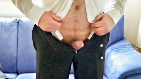 Mature hairy man stripping suit, exposing penis in exhibitionist pose