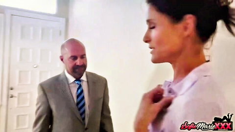 Slender dark-haired woman in blouse with suited man in softcore tease