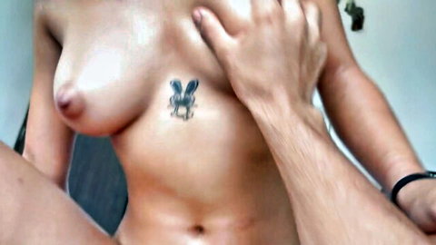 Julianapalvin topless with butterfly tattoo, hand groping her natural breasts